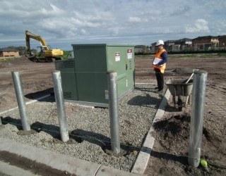 Inspecting a kiosk substation site is part of project management